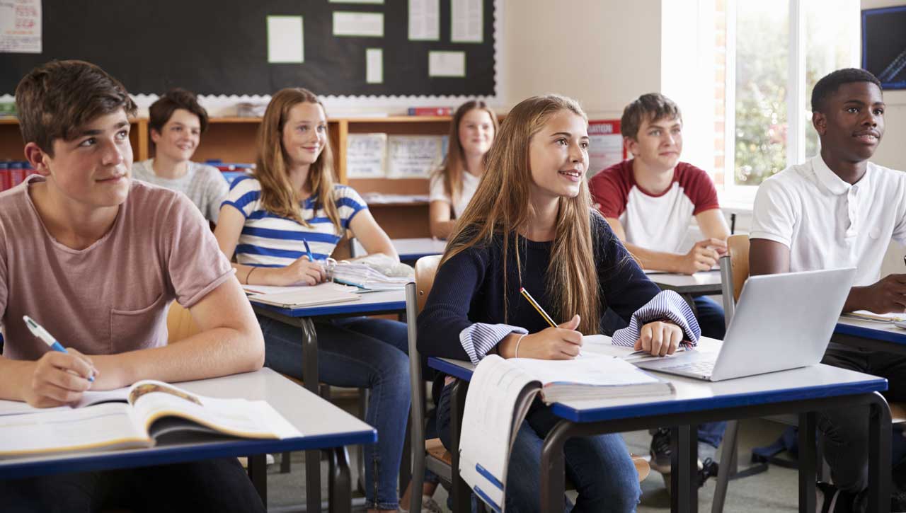 Kids at desks in a classroom