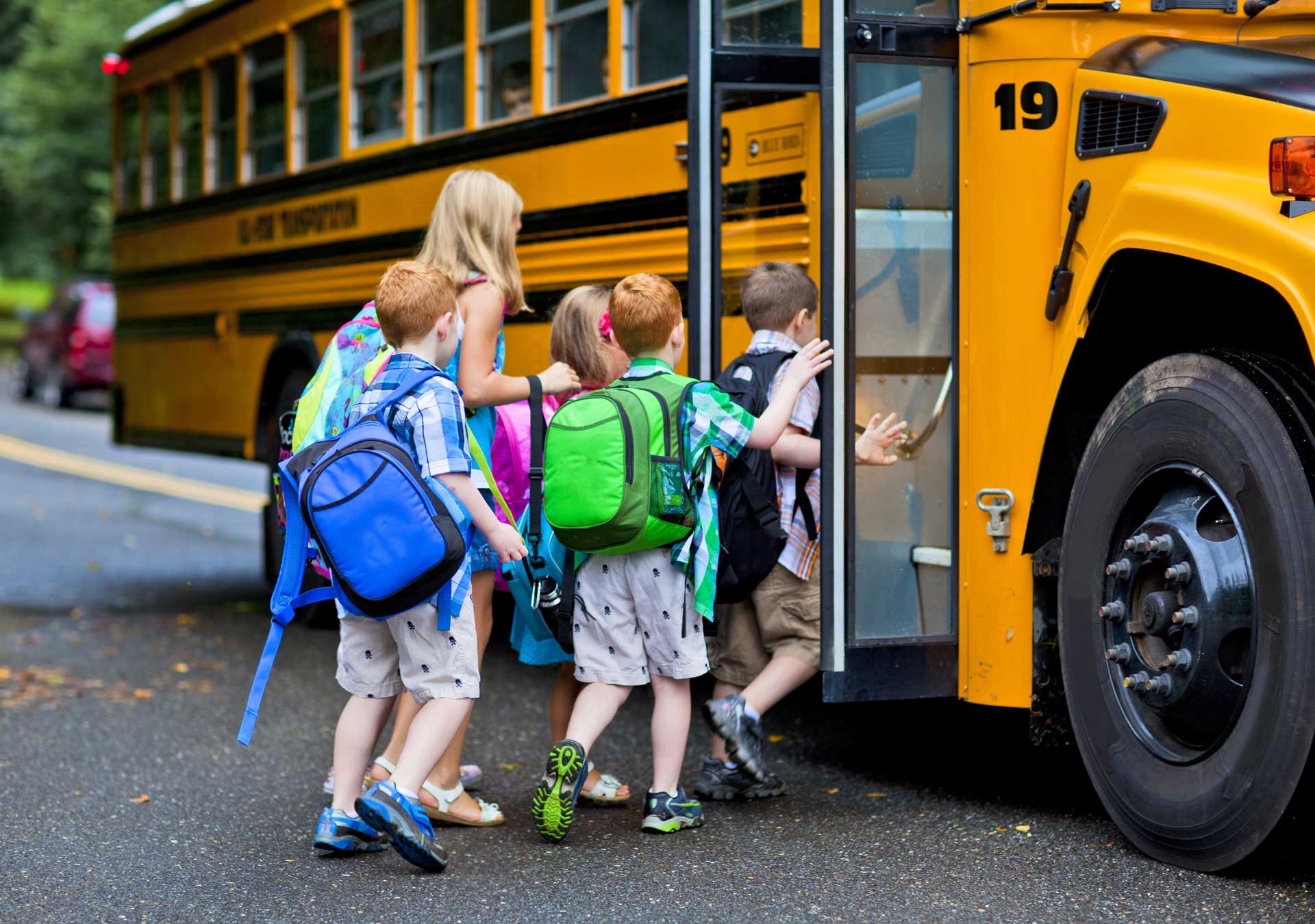 Kids getting on school bus